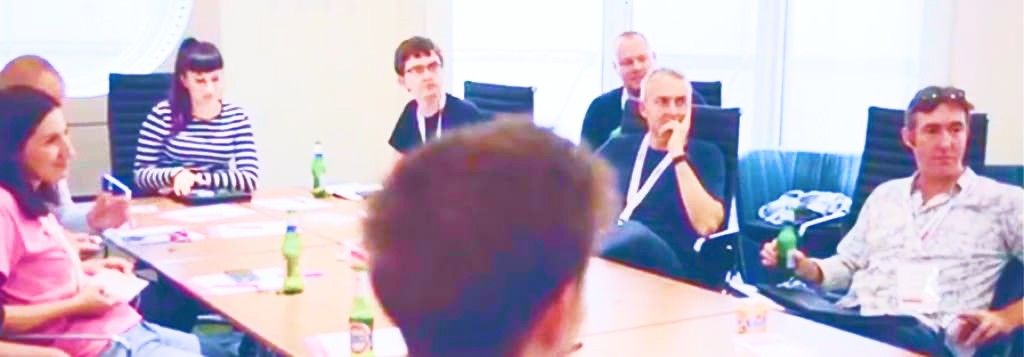 People around a conference table attending a measure camp