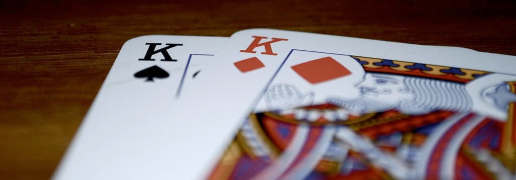 Close up of playing cards showing the king of spades and king of diamonds