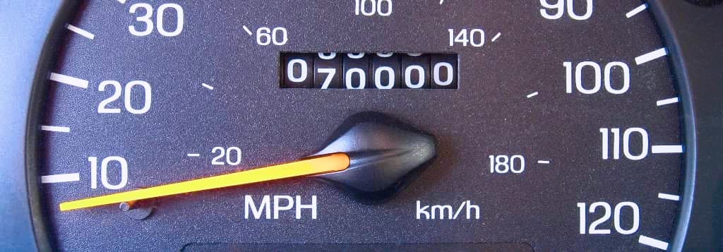 Vehicle odometer showing miles and kilometers per hour